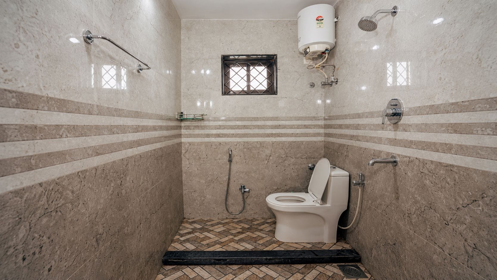 A bathroom with a shower, toilet, and a water heater.