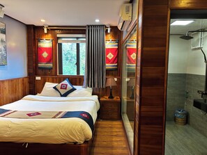A hotel room with a wooden bed, a window with curtains, a bedside table with a lamp, and a shower area. - Mountain View Homestay SaPa (Sa Pa)
