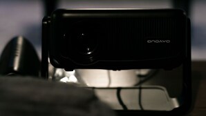 A projector with the brand name "ONOYO" on it, placed on a surface.