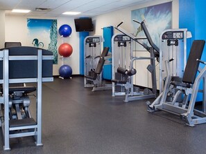 A gym with exercise machines, a wall-mounted TV, and exercise balls. - 1 Bedroom Villa at Marriott Mountain Valley Lodge (Breckenridge)