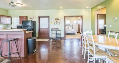 Furnished Guest House - Our spacious Guest House is ideal for families or groups, featuring three private bedrooms each with a comfortable queen bed, two full bathrooms, and plenty of room to relax.