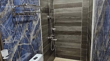 Shower, towels, soap, toilet paper