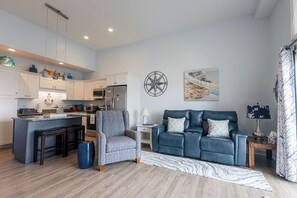 Living area - Breezy Beach Haven - 3rd story 1 bedroom condo w ac, laundry, deck, elevator. (Hampton)