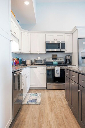 Private kitchen - Breezy Beach Haven - 3rd story 1 bedroom condo w ac, laundry, deck, elevator. (Hampton)