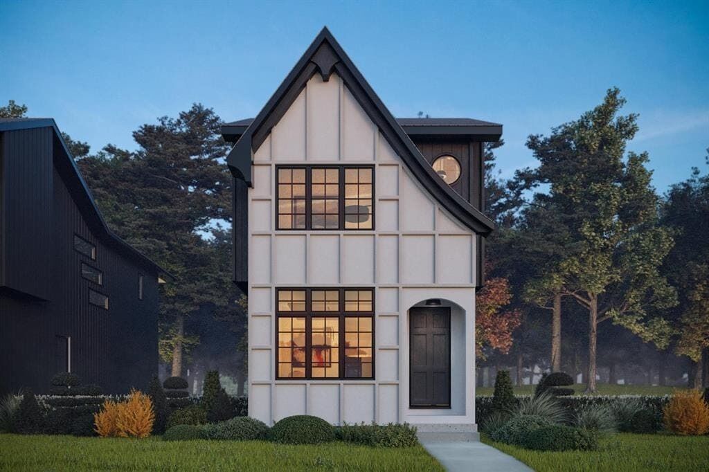 A modern two-story house with a gabled roof, large windows, and a clock tower.