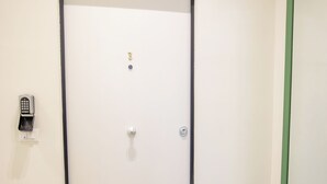 A door with a numeric keypad lock, a keyhole, and a peephole. - Luxury Boutique Apartment 3 in Palermo City Center, near the Central Station (Palermo)