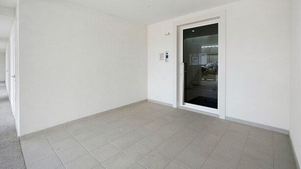 A room with a tiled floor, a door with a glass panel, and a wall-mounted control panel. - Apartment 'U Gnore - Polpo Room' with Sea View, Wi-Fi and Air Conditioning (Bari)