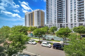 A residential area with high-rise apartment buildings, a playground, and a parking lot. - Luxury Harborpoint Apt (Stamford, CT)