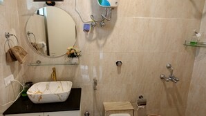 A bathroom with a sink, mirror, towel rack, toilet, bidet, and shower. - The Grove - Kudrat's Nilaya (Sea view apartment in Palolem) (Canacona)
