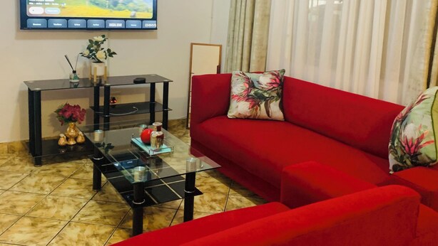 Habitación doble de lujo, patio | Área de sala de estar