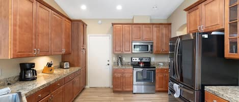 Coffee/tea maker, fridge, microwave, oven