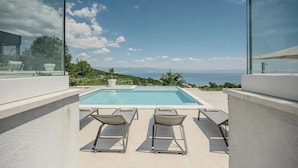 A rooftop pool with two sun loungers and a clear view of the sea. - Villa Maremont Nearby Opatija - Crovillas (Opatija)