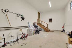 A room with a staircase, a wall-mounted star decoration, and various items scattered on the floor. - Sasquatch Beech 3BR Beech Mountain Home- Near Skiing- Fire pit- Sleeps 8 (Beech Mountain)