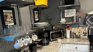 A modern kitchen with stainless steel appliances, a granite countertop, and a variety of kitchenware. - Fantastic 2-bedroom house with AC in sunny Los Angeles (Los Angeles)