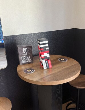 A table with a stack of blocks and a sign that reads 'DO OR DRINK BLACKOUT TOWER'. - Beautiful 3-bedroom house with pool & game room in charming Glendale (Glendale)