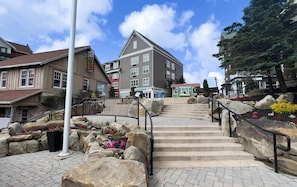 A stone staircase leading to a building with a sign 'Information' at the top. - SC 1404: Summer MTB Escape - Ride, Relax & Pool Fun (Snowshoe)