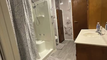 Shower, towels, soap, toilet paper