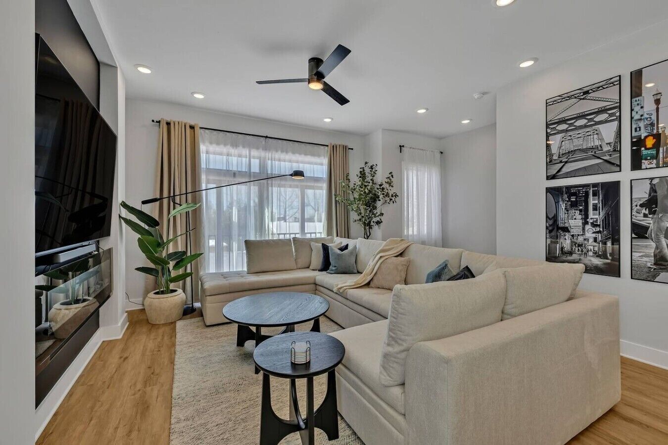 A modern living room with a sofa, coffee table, and TV.