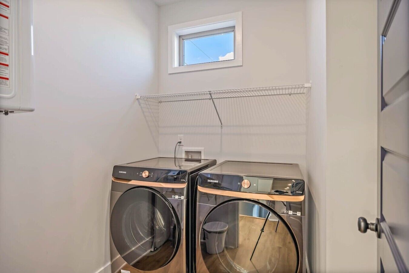 Laundry room with ironing board