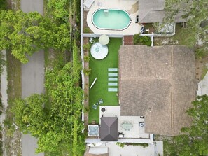 A residential property with a swimming pool, a hot tub, and a patio area with seating. - Walk to Park|Family Oasis w/ Stock Tank Pool & Spa (Largo)