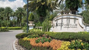 A sign for Marriott Vacation Club Lakeshore Reserve with a landscaped garden in the foreground. - Studio Villa at Lakeshore Reserve w/ Amenities (Orlando)