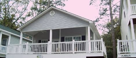 A two-story building with a balcony on the upper floor.