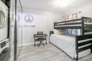 A bedroom with a bunk bed, a washing machine, a piano, and a wall with a peace symbol and the phrase 'LIFE IS GOOD'. - Walk to Town/ Golf; Pool and Hot Tub (Park City)