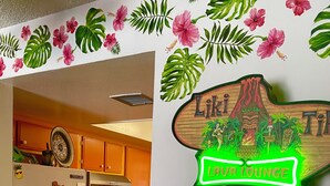 A kitchen with a refrigerator, stove, and various kitchen items. There is a sign on the wall that reads 'Lava Lounge.' - 2-bedroom condo-Fun Colorful-Fabulous Rancho Mirage- AC, pools, hot tubs, tennis (Rancho Mirage)