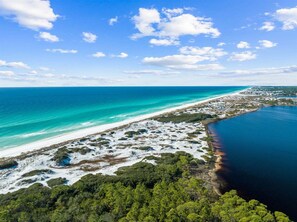 A coastal landscape with a beach, clear blue waters, and a forested area. - Sleeps 20! LSV/Golf Cart, Bikes & Private POOL! Pet-Friendly! (Santa Rosa Beach)