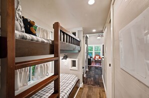 A bunk bed room with a window, a desk, and a chair. - New! Dollywood, Views, Hot Tub, Fireplace, Easy Rd (Sevierville)