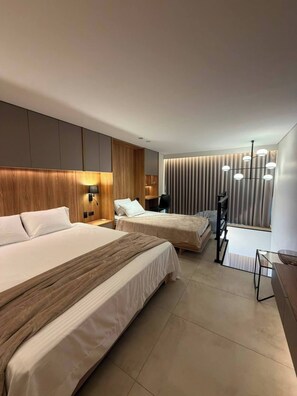 A modern hotel room with two beds, a desk, and a large window with curtains. - Luxury Duplex Loft AC Rooftop Jacuzzi Laureles (Medellín)