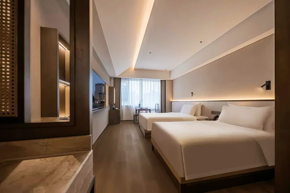 Deluxe Twin Room, Courtyard View | Premium bedding, down comforters, memory foam beds, in-room safe