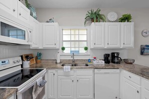 Coffee/tea maker, fridge, microwave, oven