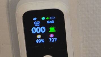 A digital thermostat displaying 000, 49%, and 73°F.