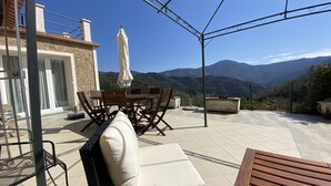 A patio with a table, chairs, and a sofa. - Book your stay at Villa Bella Vista, Liguria (Apricale)