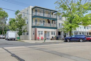 A multi-story residential building with a front porch, a fire hydrant, and a street view. - 5 Blocks to Sand! Pet-Friendly Unit in Ocean Grove (Ocean Grove)