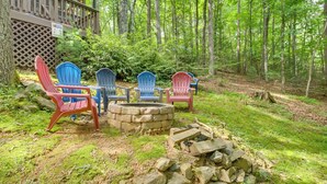 A deck with outdoor seating and a fire pit surrounded by a forest. - Hot Tub & Game Room! Wooded Retreat in Blue Ridge (Blue Ridge)
