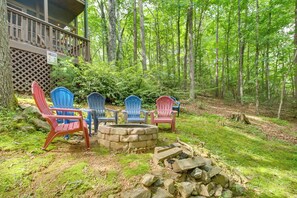 A deck with outdoor seating and a fire pit surrounded by a forest. - Hot Tub & Game Room! Wooded Retreat in Blue Ridge (Blue Ridge)