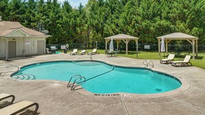 A swimming pool with a no diving sign, lounge chairs, and a gazebo. - Luxe 4BR Cabin at Innsbruck Resort in Helen (Helen)