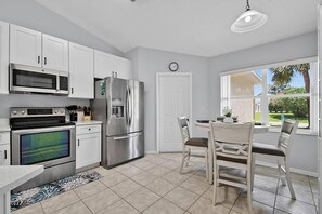 Coffee/tea maker, fridge, microwave, oven - Shady Pines Sea-renity | Waterfront Pool & Hot Tub | Golf Nearby | Palm Coast | Close To Beach (Palm Coast)
