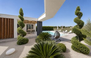 A modern outdoor pool area with lounge chairs, a pergola, and neatly trimmed hedges. - Amazing home in Zerava (Zerava)