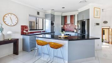Coffee/tea maker, fridge, microwave, oven