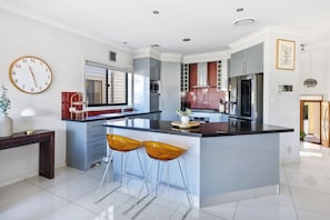 Coffee/tea maker, fridge, microwave, oven - Modern Rhodes Family Home with BBQ, Balcony & Two Living Areas (Rhodes)