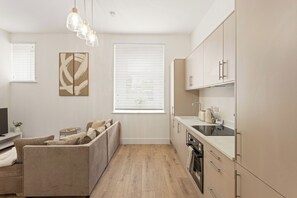 Coffee/tea maker, fridge, microwave, oven