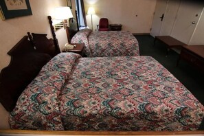 A hotel room with two beds, a desk, a chair, and a wardrobe. - Executive Inn Kershaw (Kershaw)
