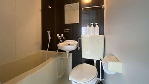 A modern bathroom with a bathtub, toilet, sink, and a mirror. - LunaStay Apartments - 301 (東京)