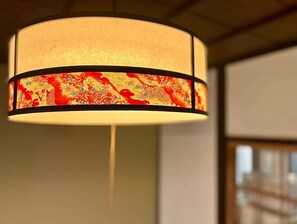 A hanging lamp with a patterned shade. - LunaStay Apartments - 302 (東京)