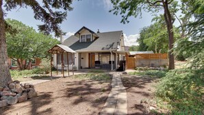 A two-story house with a covered porch and a stone pathway leading to the entrance. - Walk to SSU & Shakespeare Fest! Colorful Retreat (Cedar City)