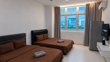Apartamento, 2 camas Queen | Cortinas blackout, ferros/tábuas de passar roupa, Wi-Fi de cortesia