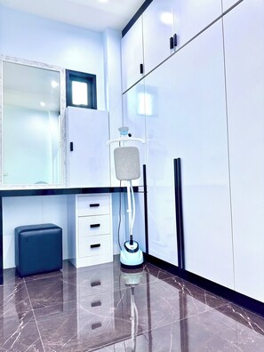 A modern bathroom with a large mirror, white cabinets, a floor lamp, and a marble-tiled floor. - Ao nang Private Rooftop Poolvilla (Tambon Ao Nang)